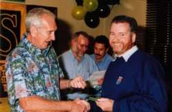 John Sprinzel presents 3rd in SCCA Driver's Championship trophy to Chris Dimmock, Sydney 2000
